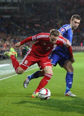 101014 - Wales v Bosnia-Herzegovina, UEFA European Championship 2016 - Wales' Chris Gunter and Bosnia and Hertzegovina's Tino-Sven Susic compete for the ball