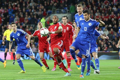 101014 - Wales v Bosnia-Herzegovina, UEFA European Championship 2016 - Wales' Ashley Williams looks to win the ball from Bosnia and Hertzegovina's Mensur Mujdza