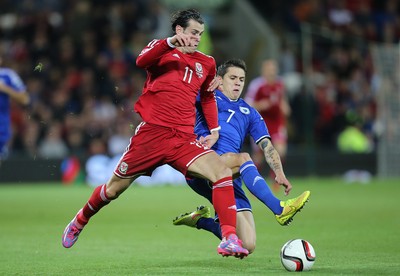 101014 - Wales v Bosnia-Herzegovina, UEFA European Championship 2016 - Wales' Gareth Bale is brought down by Bosnia and Hertzegovina's Muhamed Besic