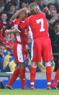 120203 - Wales v Bosnia-Herzegovina - International friendly - Wales' Robert Earnshaw is congratulated by Robbie Savage on goal