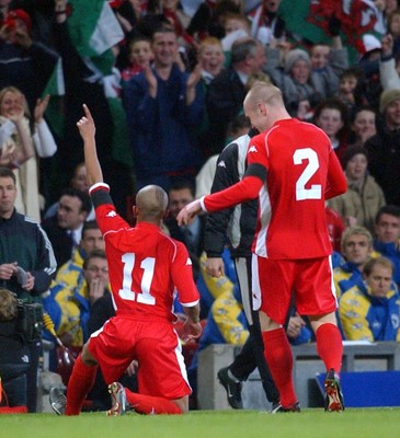 120203 - Wales v Bosnia-Herzegovina - International friendly - Wales' Robert Earnshaw (left) and Rhys Weston celebrate Earnshaw's goal