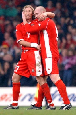 120203 - Wales v Bosnia-Herzegovina - International friendly - Wales' Robbie Savage breathes a sigh of relief as he congratulates John Hartson on his equalizer