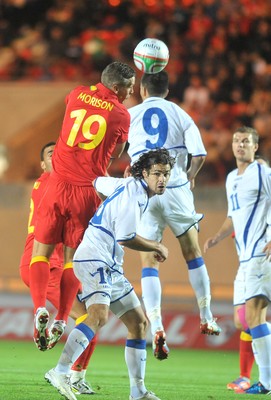 150812 - Wales v Bosnia Herzegovina, Vauxhall International Friendly -   Steve Morison of Wales,  left, compete's for the ball with Vedad Ibisevic and Adnan Zahirovic  of Bosnia Herzegovina   