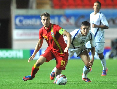 150812 - Wales v Bosnia Herzegovina, Vauxhall International Friendly -   Aaron Ramsey of Wales, right, compete's for the ball with Muhamed Besic of Bosnia Herzegovina   