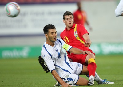 150812 - Wales v Bosnia Herzegovina, Vauxhall International Friendly - Wales' Gareth Bale is tackled by Bosnia Herzegovina's Emir Spahic 