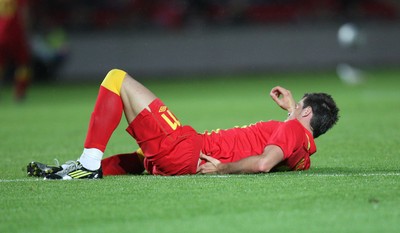 150812 - Wales v Bosnia Herzegovina, Vauxhall International Friendly - Wales' Gareth Bale waits for treatment after injuring his lower back