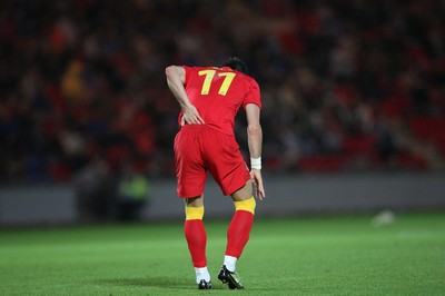 150812 - Wales v Bosnia Herzegovina, Vauxhall International Friendly - Wales' Gareth Bale waits for treatment after injuring his lower back