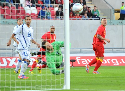 150812 - Wales - v - Bosnia Herzegovina -  Ashley Williams of Wales,  far left, watches as his shot is saved   