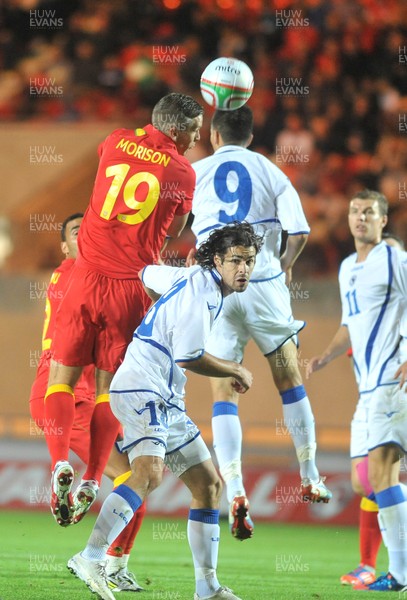 150812 - Wales v Bosnia Herzegovina, Vauxhall International Friendly -   Steve Morison of Wales,  left, compete's for the ball with Vedad Ibisevic and Adnan Zahirovic  of Bosnia Herzegovina   