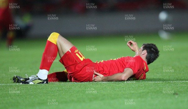 150812 - Wales v Bosnia Herzegovina, Vauxhall International Friendly - Wales' Gareth Bale waits for treatment after injuring his lower back