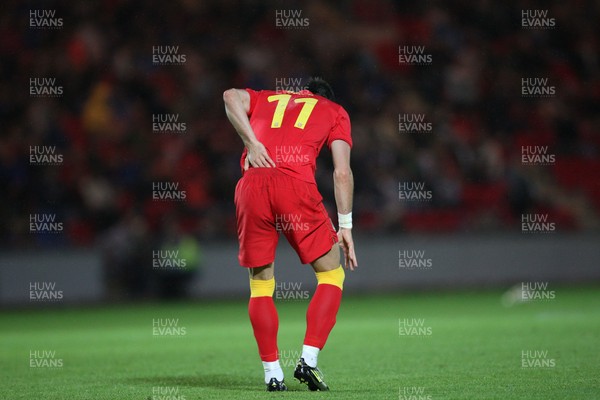 150812 - Wales v Bosnia Herzegovina, Vauxhall International Friendly - Wales' Gareth Bale waits for treatment after injuring his lower back