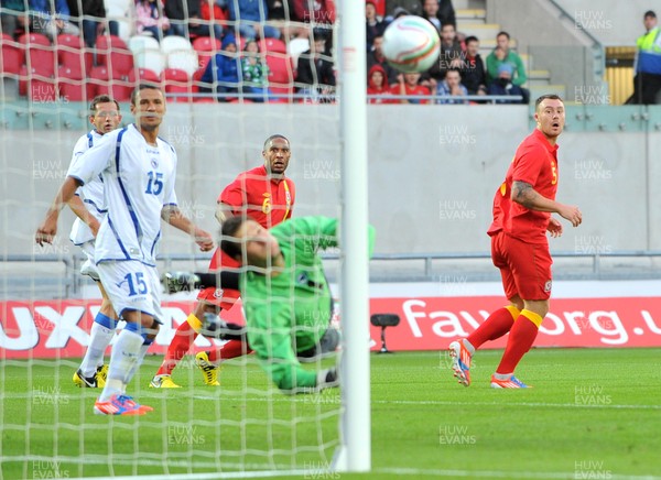 150812 - Wales - v - Bosnia Herzegovina -  Ashley Williams of Wales,  far left, watches as his shot is saved   