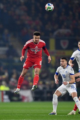 260326 - Wales v Bosnia-Herzegovina - 2026 FIFA World Cup Qualifying - Play-off Semi-final - Ethan Ampadu of Wales heads the ball