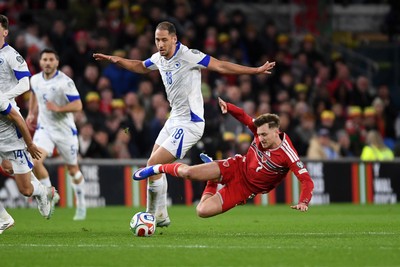 260326 - Wales v Bosnia-Herzegovina - 2026 FIFA World Cup Qualifying - Play-off Semi-final - David Brooks of Wales is challenged by Dario Saric of Bosnia