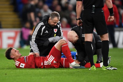 260326 - Wales v Bosnia-Herzegovina - 2026 FIFA World Cup Qualifying - Play-off Semi-final - Ethan Ampadu of Wales receives treatment