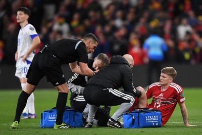 260326 - Wales v Bosnia-Herzegovina - 2026 FIFA World Cup Qualifying - Play-off Semi-final - Jordan James of Wales receives treatment