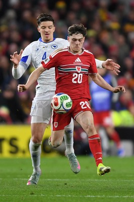 260326 - Wales v Bosnia-Herzegovina - 2026 FIFA World Cup Qualifying - Play-off Semi-final - Daniel James of Wales is challenged by Tarik Muharemovic of Bosnia