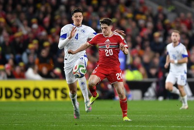 260326 - Wales v Bosnia-Herzegovina - 2026 FIFA World Cup Qualifying - Play-off Semi-final - Daniel James of Wales is challenged by Tarik Muharemovic of Bosnia