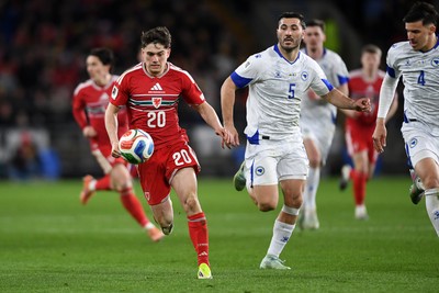 260326 - Wales v Bosnia-Herzegovina - 2026 FIFA World Cup Qualifying - Play-off Semi-final - Daniel James of Wales is challenged by Denis Huseinbasic of Bosnia