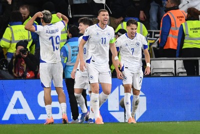 260326 - Wales v Bosnia-Herzegovina - 2026 FIFA World Cup Qualifying - Play-off Semi-final - Edin Dzeko of Bosnia celebrates scoring a goal with team mates]