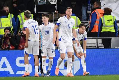 260326 - Wales v Bosnia-Herzegovina - 2026 FIFA World Cup Qualifying - Play-off Semi-final - Edin Dzeko of Bosnia celebrates scoring a goal with team mates]