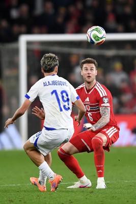 260326 - Wales v Bosnia-Herzegovina - 2026 FIFA World Cup Qualifying - Play-off Semi-final - Joe Rodon of Wales is challenged by Kerim Alajbegovic of Bosnia