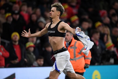 260326 - Wales v Bosnia-Herzegovina - 2026 FIFA World Cup Qualifying - Play-off Semi-final - Kerim Alajbegovic of Bosnia runs towards his sides fans in celebration after scoring the winning penalty