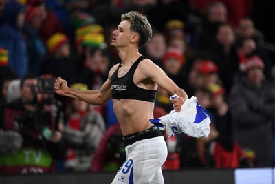 260326 - Wales v Bosnia-Herzegovina - 2026 FIFA World Cup Qualifying - Play-off Semi-final - Kerim Alajbegovic of Bosnia runs towards his sides fans in celebration after scoring the winning penalty
