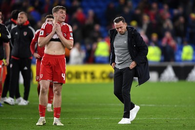 260326 - Wales v Bosnia-Herzegovina - 2026 FIFA World Cup Qualifying - Play-off Semi-final - Dejected Dylan Lawlor  and Craig Bellamy, Wales Manager