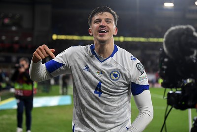 260326 - Wales v Bosnia-Herzegovina - 2026 FIFA World Cup Qualifying - Play-off Semi-final - Tarik Muharemovic of Bosnia celebrates at full time