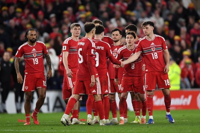 260326 - Wales v Bosnia-Herzegovina - 2026 FIFA World Cup Qualifying - Play-off Semi-final - Dejected Neco Williams of Wales after missing his penalty is consoled by Ethan Ampadu of Wales