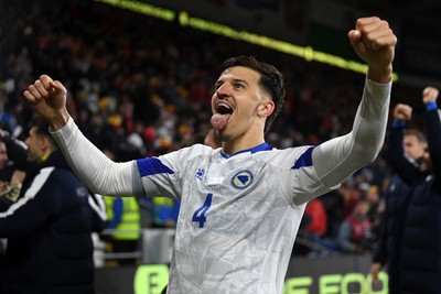 260326 - Wales v Bosnia-Herzegovina - 2026 FIFA World Cup Qualifying - Play-off Semi-final - Tarik Muharemovic of Bosnia celebrates at full time