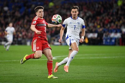 260326 - Wales v Bosnia-Herzegovina - 2026 FIFA World Cup Qualifying - Play-off Semi-final - Daniel James of Wales is challenged by Amar Dedic of Bosnia