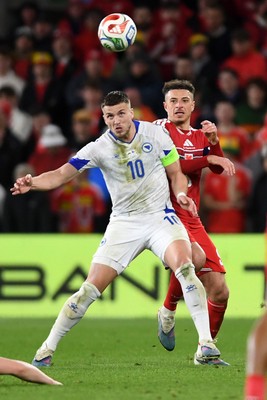 260326 - Wales v Bosnia-Herzegovina - 2026 FIFA World Cup Qualifying - Play-off Semi-final - Ethan Ampadu of Wales is challenged by Ermedin Demirovic of Bosnia