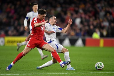 260326 - Wales v Bosnia-Herzegovina - 2026 FIFA World Cup Qualifying - Play-off Semi-final - Mark Harris of Wales is challenged by Ivan Basic of Bosnia
