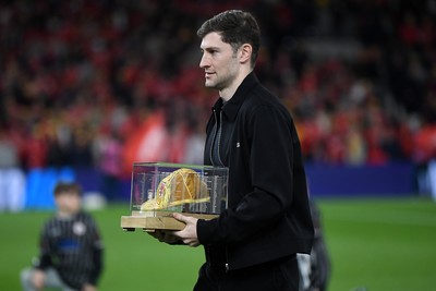 260326 - Wales v Bosnia-Herzegovina - 2026 FIFA World Cup Qualifying - Play-off Semi-final - Ben Davies of Wales is presented with a cap before the match
