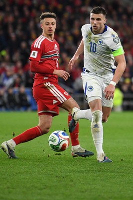 260326 - Wales v Bosnia-Herzegovina - 2026 FIFA World Cup Qualifying - Play-off Semi-final - Ethan Ampadu of Wales is challenged by Ermedin Demirovic of Bosnia