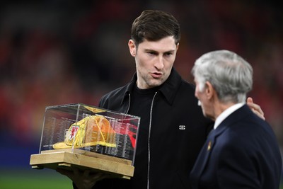 260326 - Wales v Bosnia-Herzegovina - 2026 FIFA World Cup Qualifying - Play-off Semi-final - Ben Davies of Wales is presented with a cap before the match