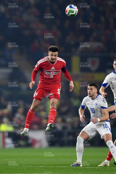 260326 - Wales v Bosnia-Herzegovina - 2026 FIFA World Cup Qualifying - Play-off Semi-final - Ethan Ampadu of Wales heads the ball