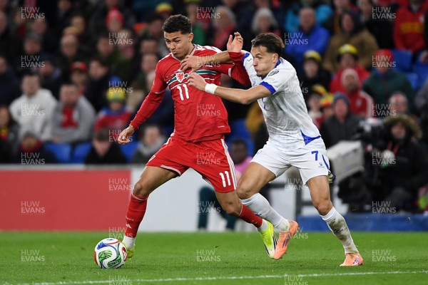 260326 - Wales v Bosnia-Herzegovina - 2026 FIFA World Cup Qualifying - Play-off Semi-final - Brennan Johnson of Wales is challenged by Amar Dedic of Bosnia
