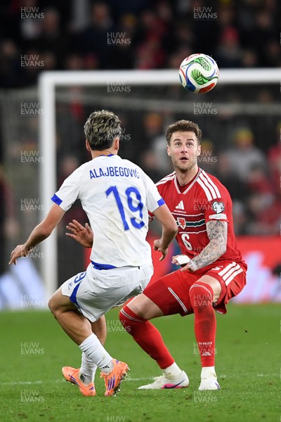 260326 - Wales v Bosnia-Herzegovina - 2026 FIFA World Cup Qualifying - Play-off Semi-final - Joe Rodon of Wales is challenged by Kerim Alajbegovic of Bosnia