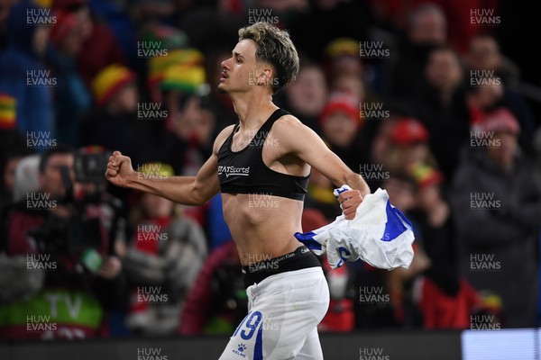 260326 - Wales v Bosnia-Herzegovina - 2026 FIFA World Cup Qualifying - Play-off Semi-final - Kerim Alajbegovic of Bosnia runs towards his sides fans in celebration after scoring the winning penalty