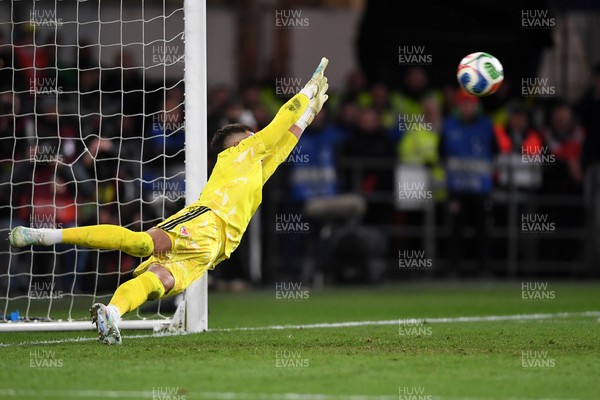 260326 - Wales v Bosnia-Herzegovina - 2026 FIFA World Cup Qualifying - Play-off Semi-final - Karl Darlow of Wales saves a penalty 