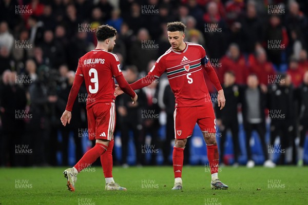 260326 - Wales v Bosnia-Herzegovina - 2026 FIFA World Cup Qualifying - Play-off Semi-final - Dejected Neco Williams of Wales after missing his penalty is consoled by Ethan Ampadu of Wales