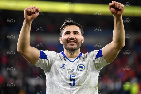 260326 - Wales v Bosnia-Herzegovina - 2026 FIFA World Cup Qualifying - Play-off Semi-final - Denis Huseinbasic of Bosnia celebrates at full time