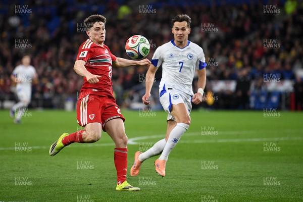 260326 - Wales v Bosnia-Herzegovina - 2026 FIFA World Cup Qualifying - Play-off Semi-final - Daniel James of Wales is challenged by Amar Dedic of Bosnia