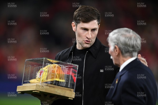 260326 - Wales v Bosnia-Herzegovina - 2026 FIFA World Cup Qualifying - Play-off Semi-final - Ben Davies of Wales is presented with a cap before the match