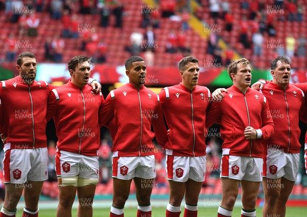 030721 - Wales v Canada - Summer International Rugby - Jonah Holmes, Taine Basham, Ben Thomas, Kieran Hardy, Nick Tompkins and Ryan Elias during the anthems