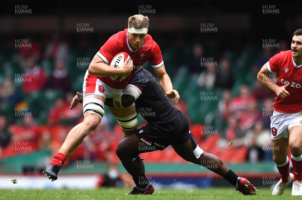 030721 - Wales v Canada - Summer International Rugby - Ben Carter of Wales is tackled by Djustive Sears-Duru of Canada