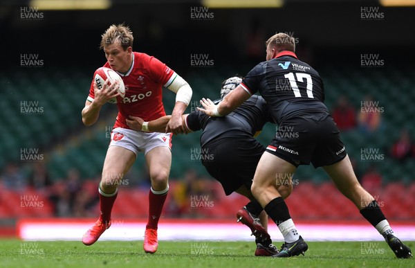 030721 - Wales v Canada - Summer International Rugby - Nick Tompkins of Wales is tackled by Andrew Quattrin of Canada